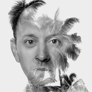 Black and white drawing of a man's face fading into palm trees