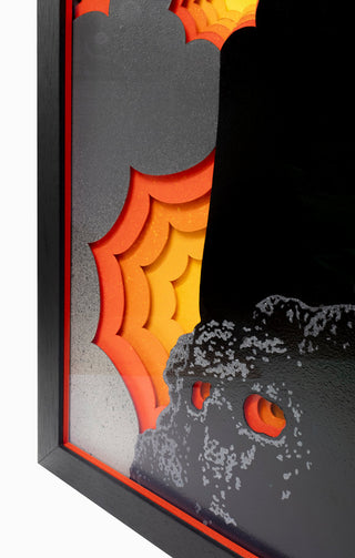 Close-up of a decorative wall piece with orange, gray, and black colors.