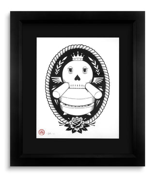 Framed black and white illustration of a skull with floral elements on a white background