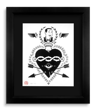 Framed black and white artwork with a central heart design featuring an eye and arrows.