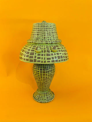 Decorative lamp with a checkered pattern on an orange background