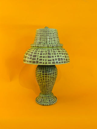 Decorative lamp with a checkered pattern on an orange background