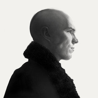 Black and white drawing of the side profile of a bald man